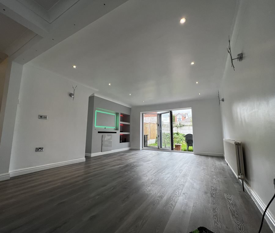 A freshly finished living room with bifold doors onto the garden